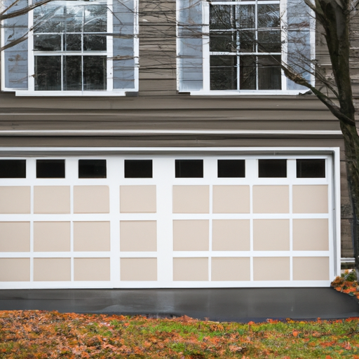 Insulated residential garage door on a Concord, MA home in late autumn; door panels and seals visible