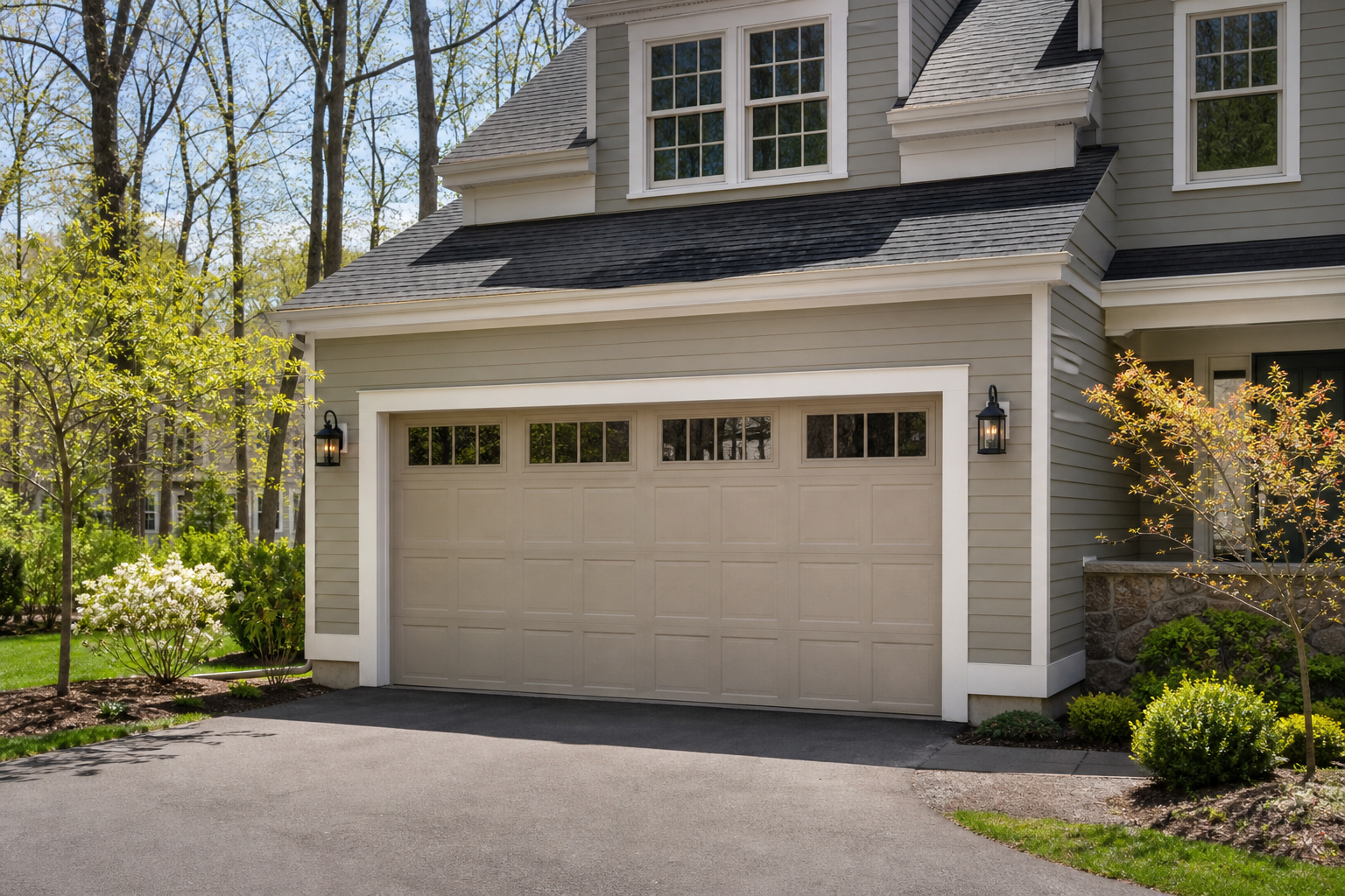 Suburban Concord garage exterior with a visible sectional garage door in daylight
